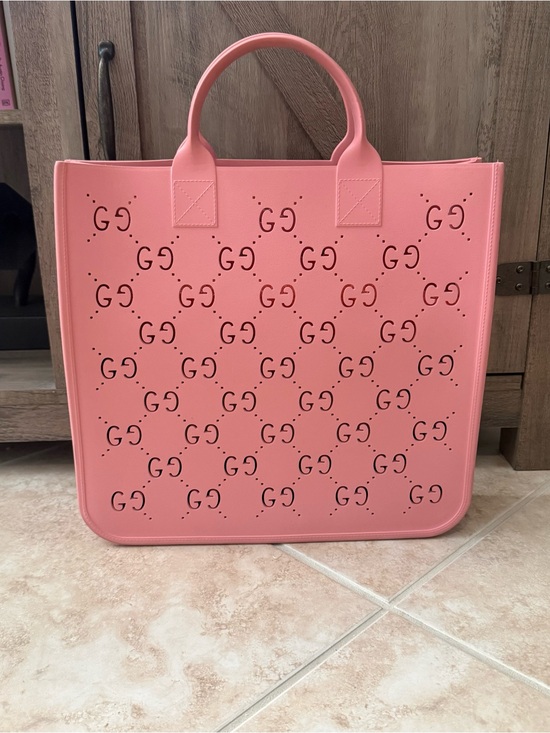 Gucci Handbags - Gucci Pink Perforated GG Rubber Tote